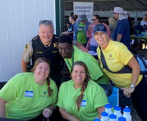 SAFER Volunteers smile for the camera